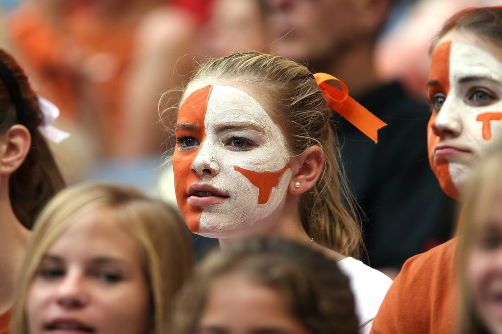A University of Texas football fan with face painted